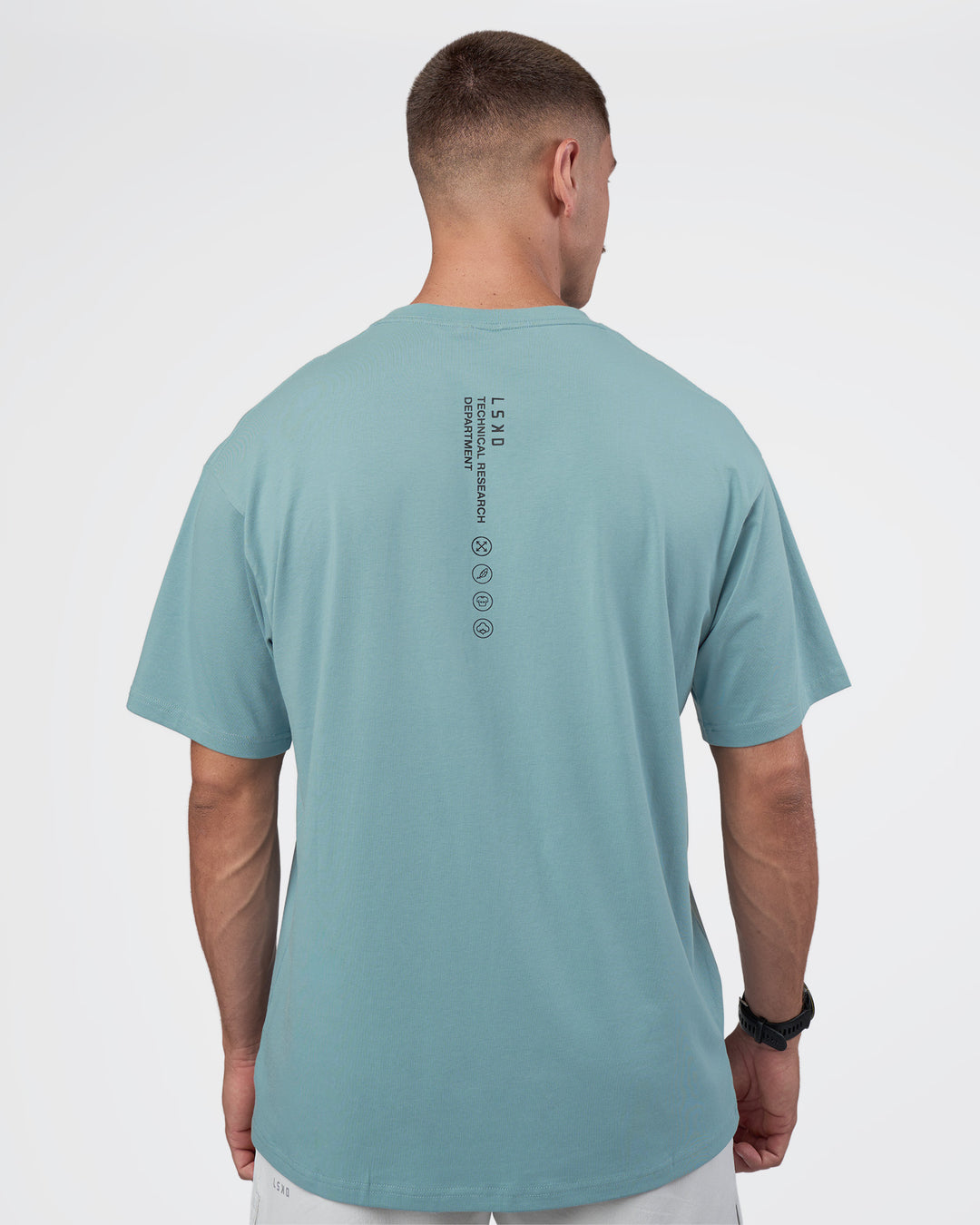 Man wearing Research Department FLXCotton Oversized Tee - Smoke Blue | Model:Nikola | Size:L