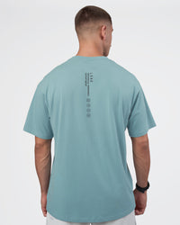 Man wearing Research Department FLXCotton Oversized Tee - Smoke Blue | Model:Nikola | Size:L