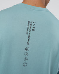 Man wearing Research Department FLXCotton Oversized Tee - Smoke Blue | Model:Nikola | Size:L