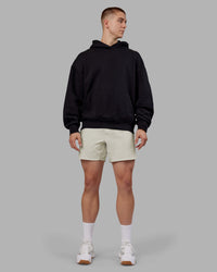 Man wearing Rise & Lift Hoodie Oversized - Black-White | Model:Tom | Size:L