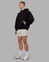 Man wearing Rise & Lift Hoodie Oversized - Black-White | Model:Tom | Size:L