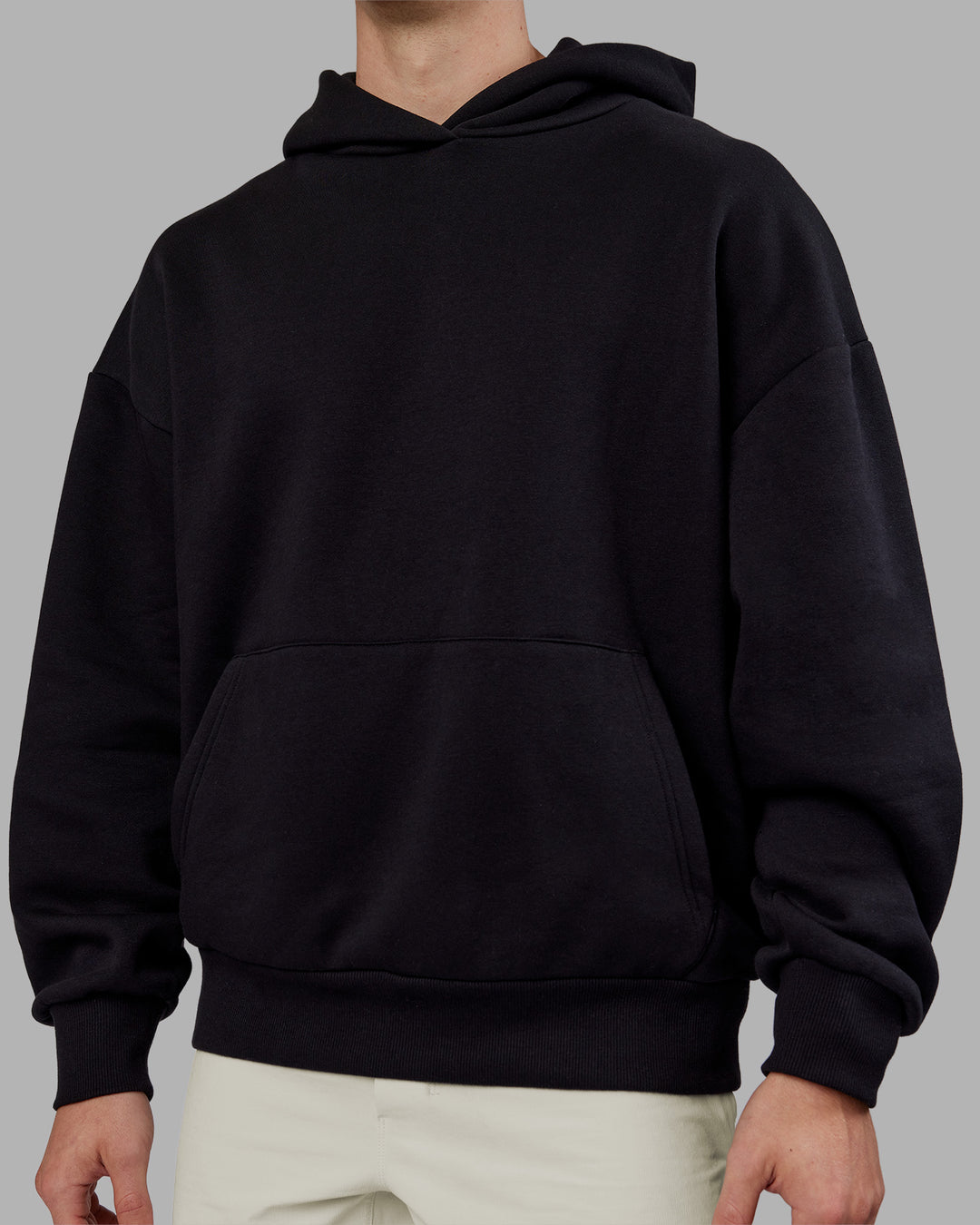 Man wearing Rise &amp; Lift Hoodie Oversized - Black-White | Model:Tom | Size:L