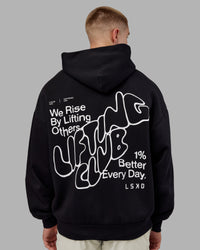 Man wearing Rise & Lift Hoodie Oversized - Black-White | Model:Tom | Size:L