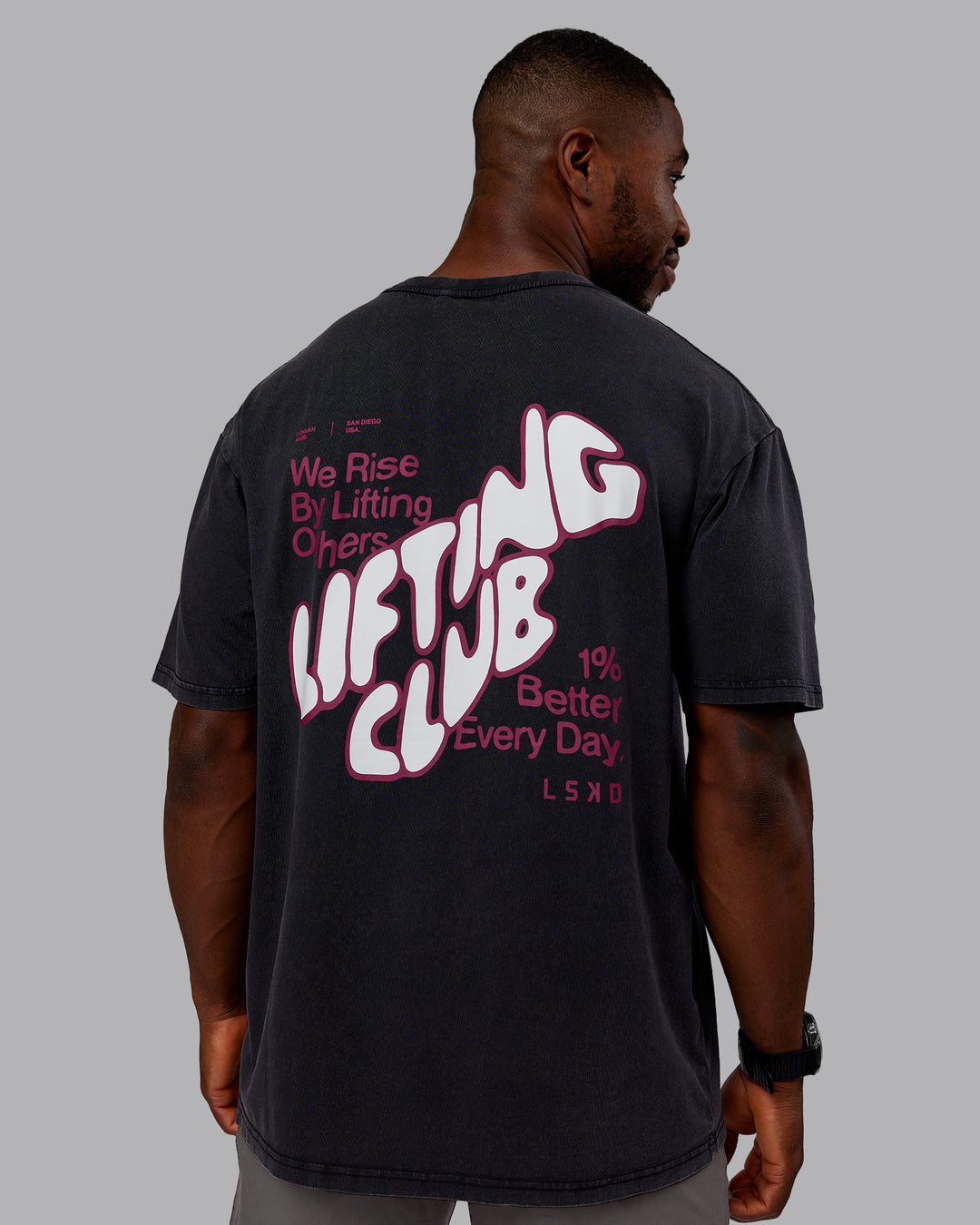 Man wearing Rise &amp; Lift Washed FLXCotton Oversized Tee - Black-Plum Berry | Model:Sam | Size:L