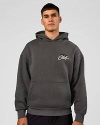 Man wearing Run Club Script Oversized Hoodie - Dark Storm-Alloy | Model:Jackson | Size:L