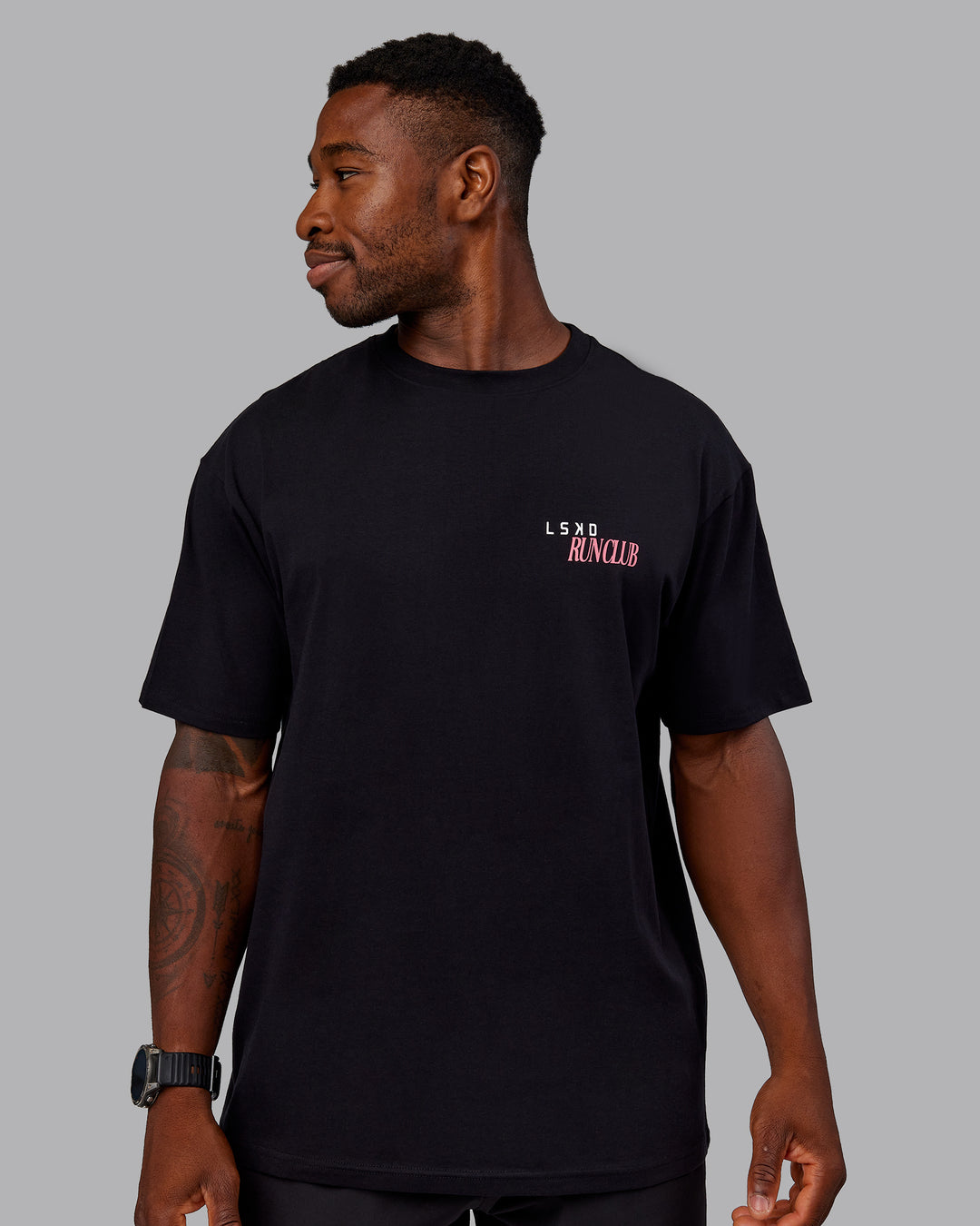 Man wearing Run Love FLXCotton Oversized Tee - Black-Pink Lemonade | Model:Sam | Size:L