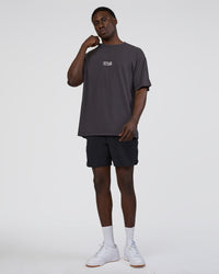 Man wearing Runner's FLXCotton Oversized Tee - Black Washed-White | Model:Paabio | Size:L