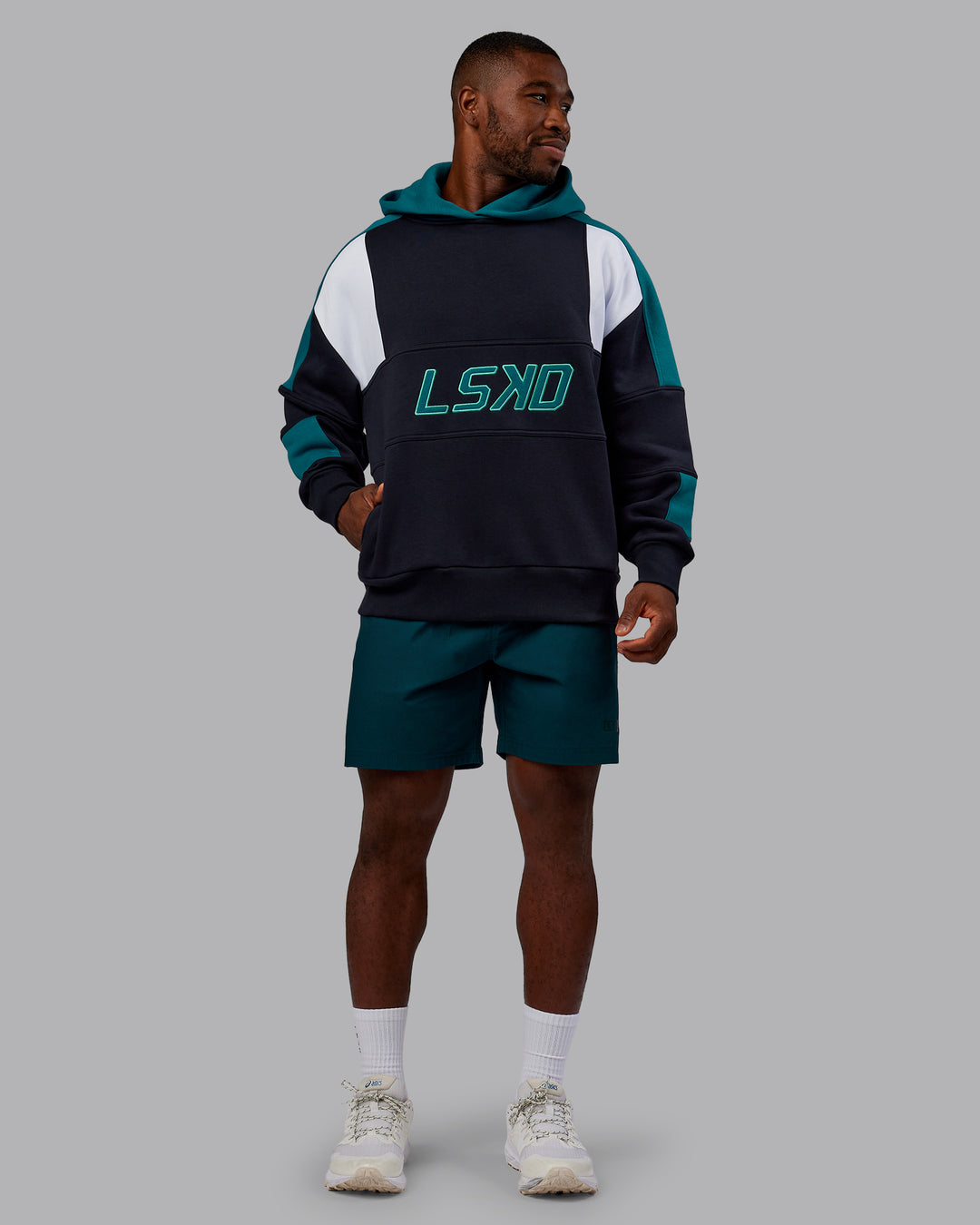 Man wearing Slam Oversized Hoodie - Caviar-Blue Coral | Model:Sam | Size:L
