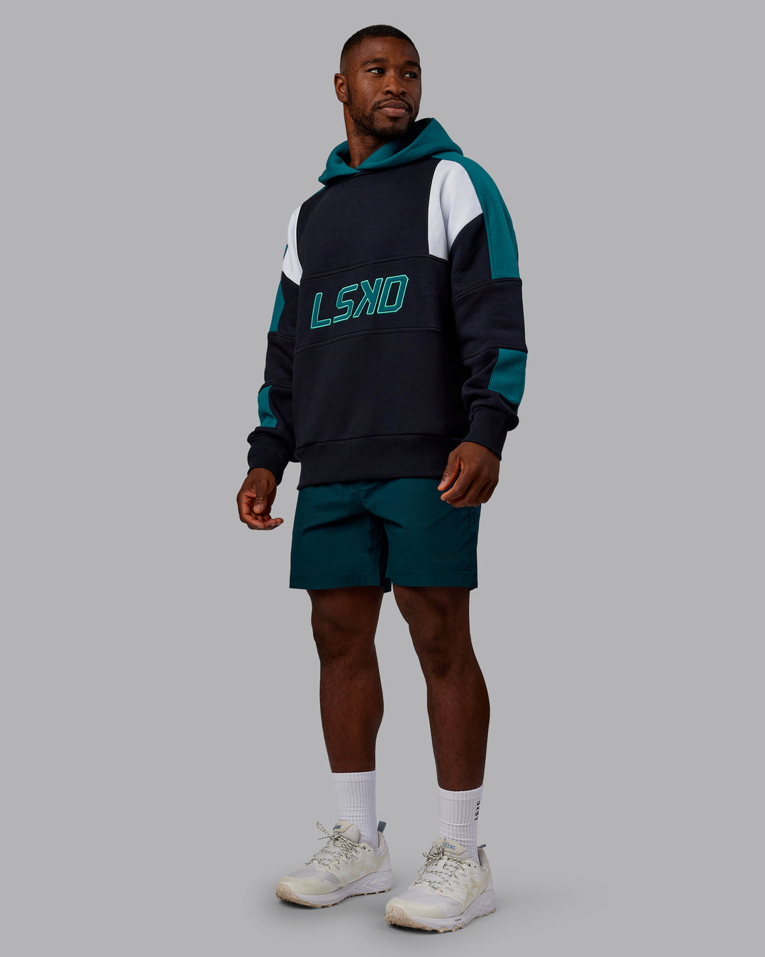 Man wearing Slam Oversized Hoodie - Caviar-Blue Coral | Model:Sam | Size:L