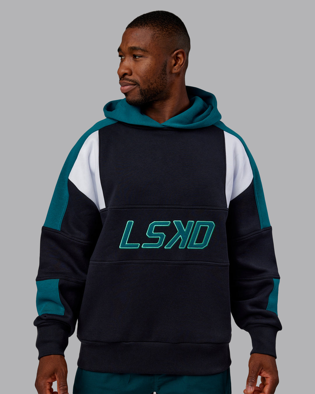 Man wearing Slam Oversized Hoodie - Caviar-Blue Coral | Model:Sam | Size:L