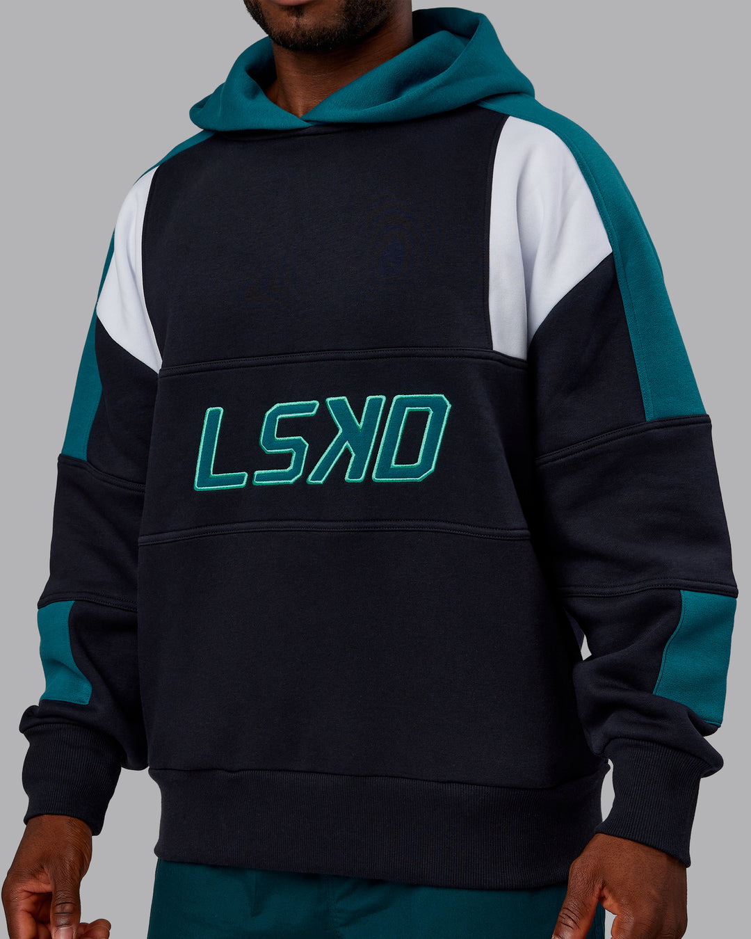 Man wearing Slam Oversized Hoodie - Caviar-Blue Coral | Model:Sam | Size:L