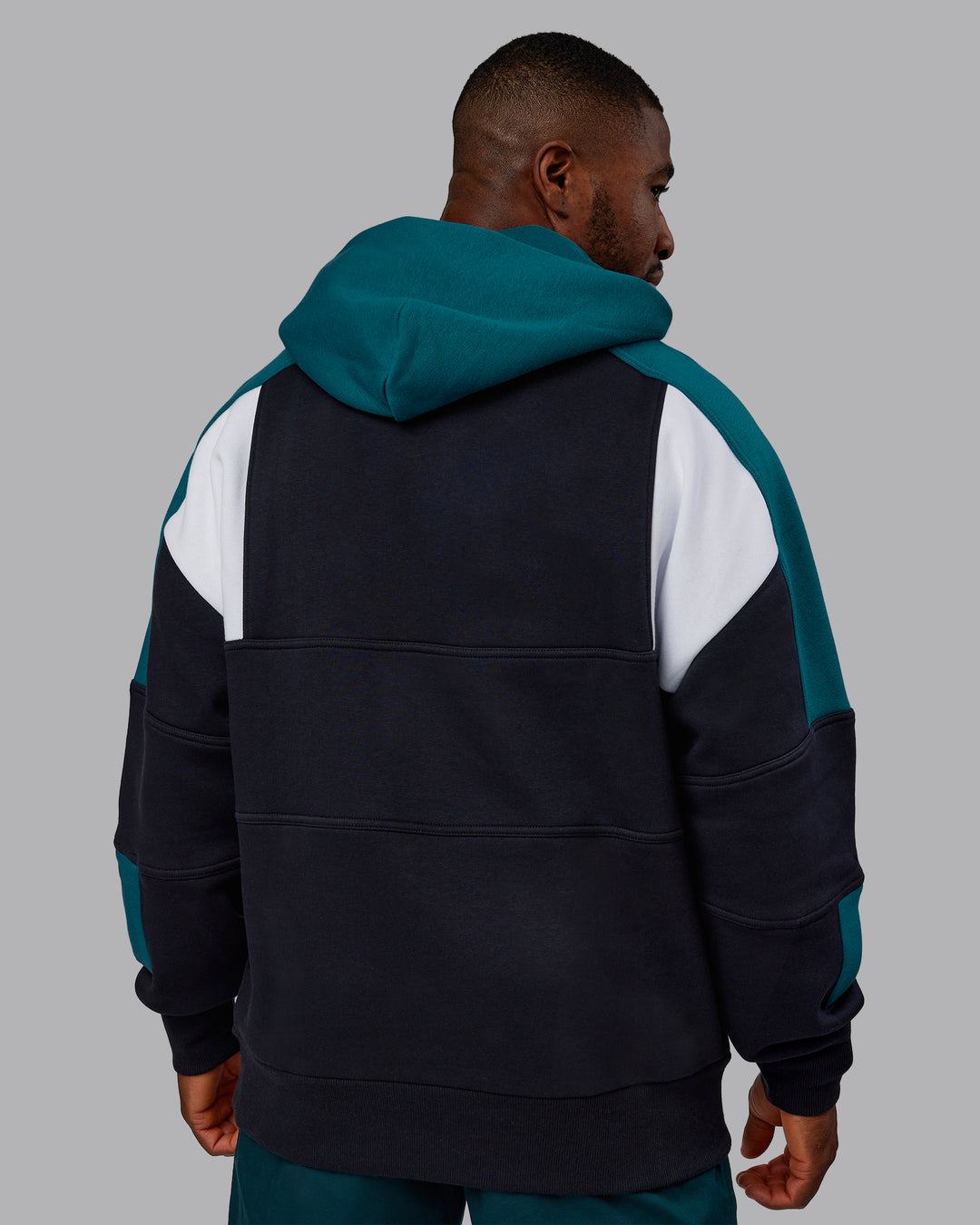 Man wearing Slam Oversized Hoodie - Caviar-Blue Coral | Model:Sam | Size:L