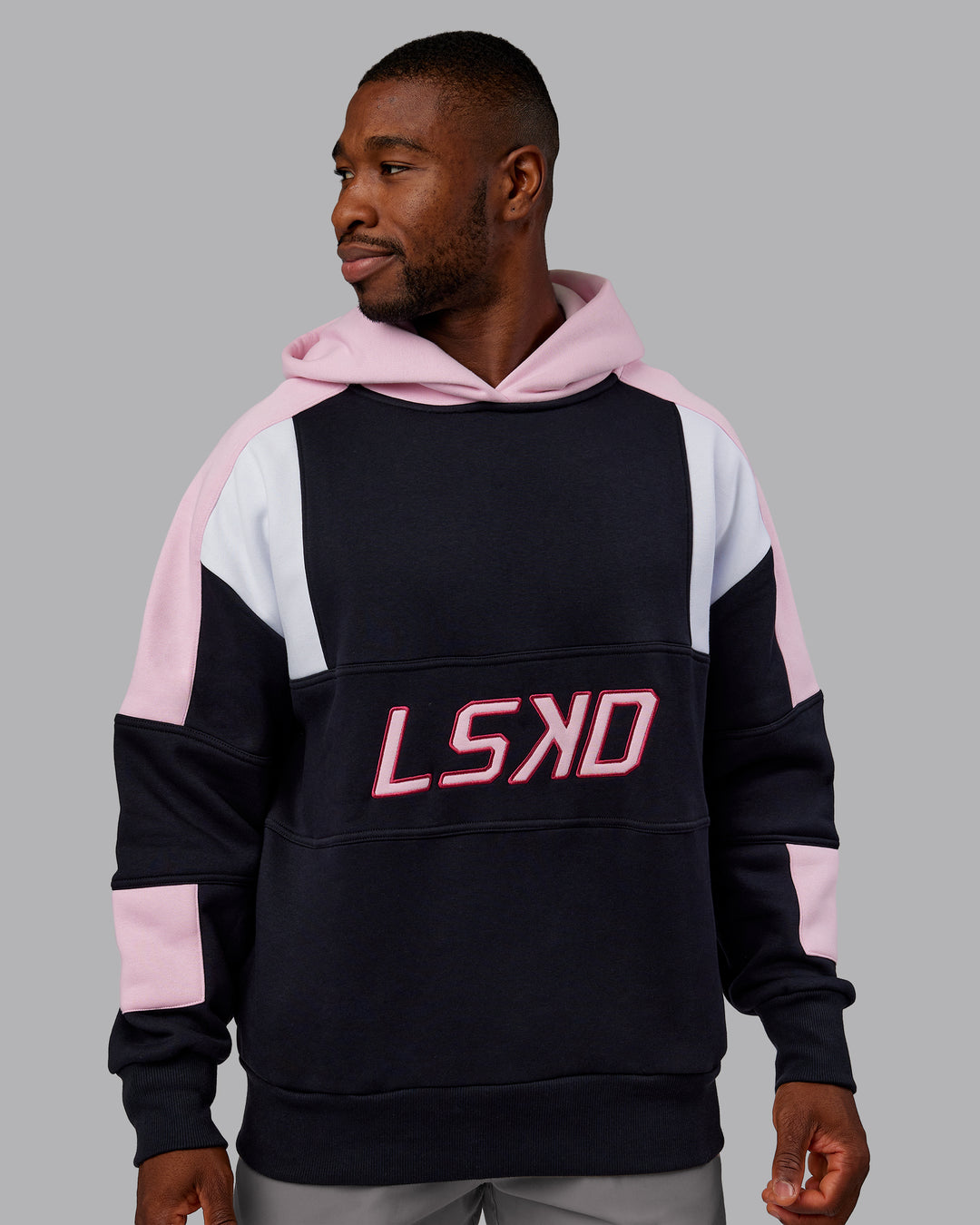 Man wearing Slam Oversized Hoodie - Caviar-Light Bubblegum | Model:Sam | Size:L