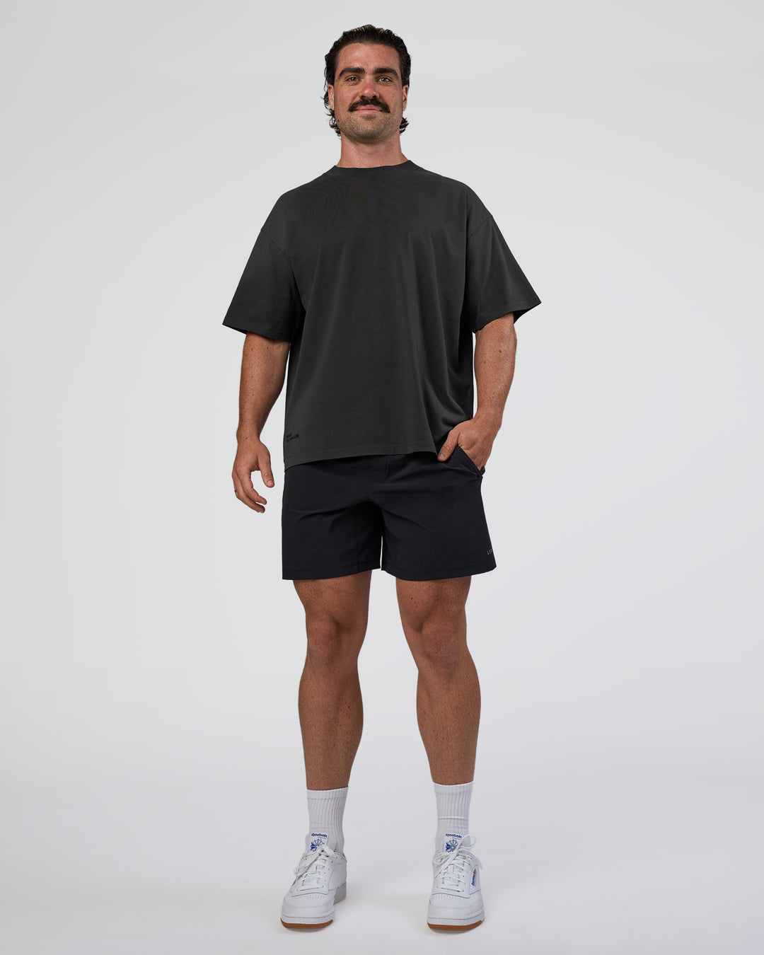 Man wearing Spray Heavyweight Unisex Oversized Tee - Charcoal Washed | Model:Adam | Size:L