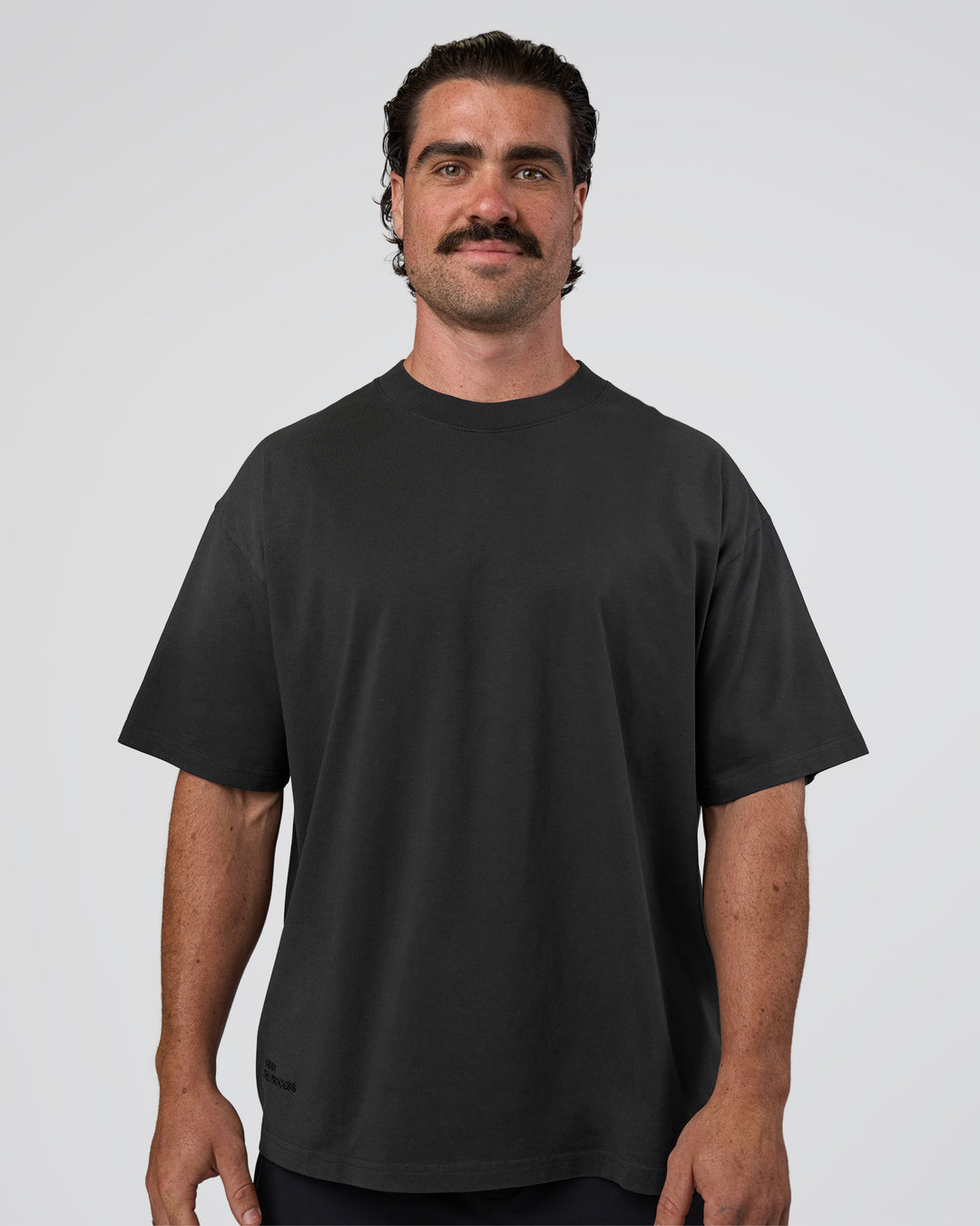 Man wearing Spray Heavyweight Unisex Oversized Tee - Charcoal Washed | Model:Adam | Size:L