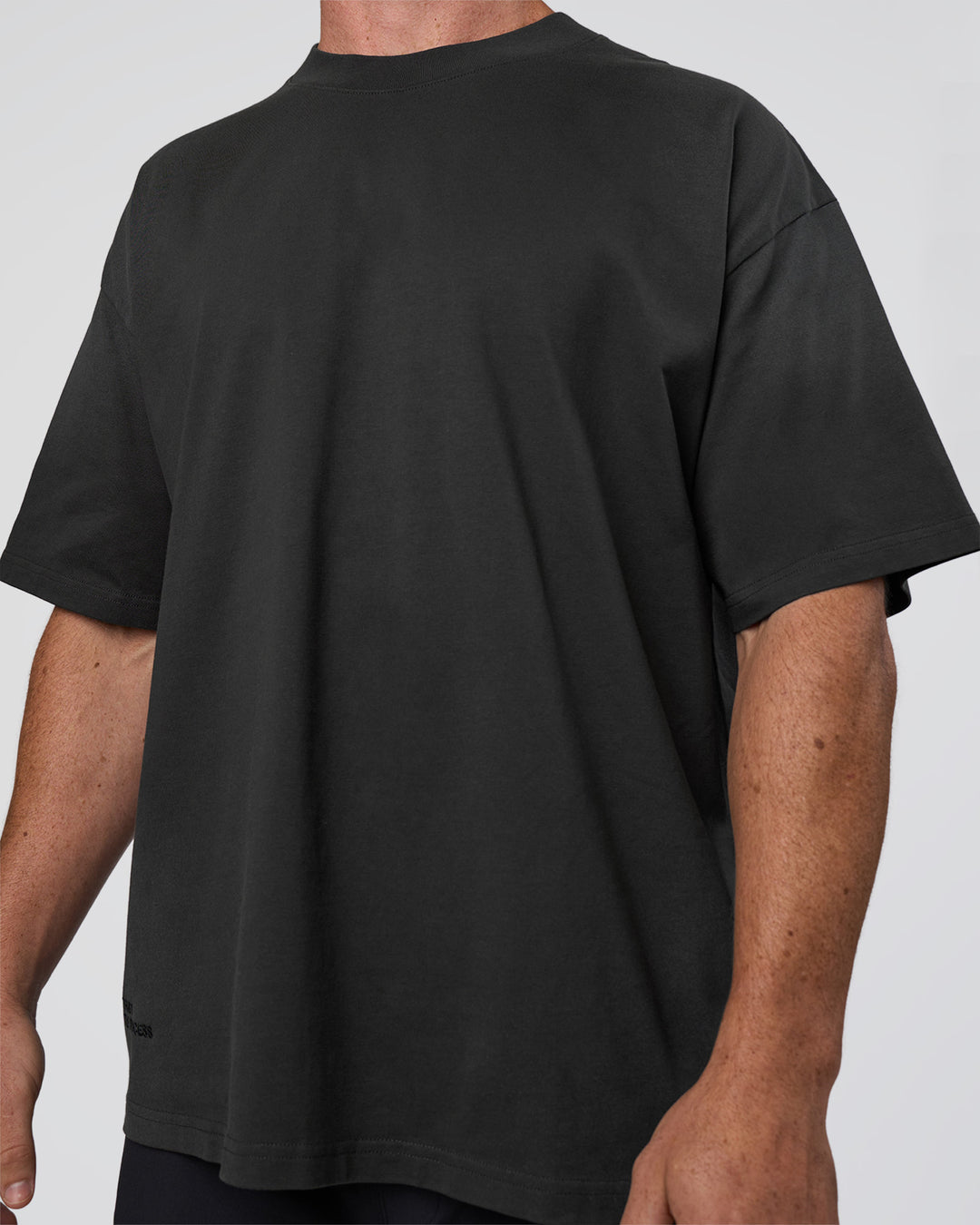 Man wearing Spray Heavyweight Unisex Oversized Tee - Charcoal Washed | Model:Adam | Size:L