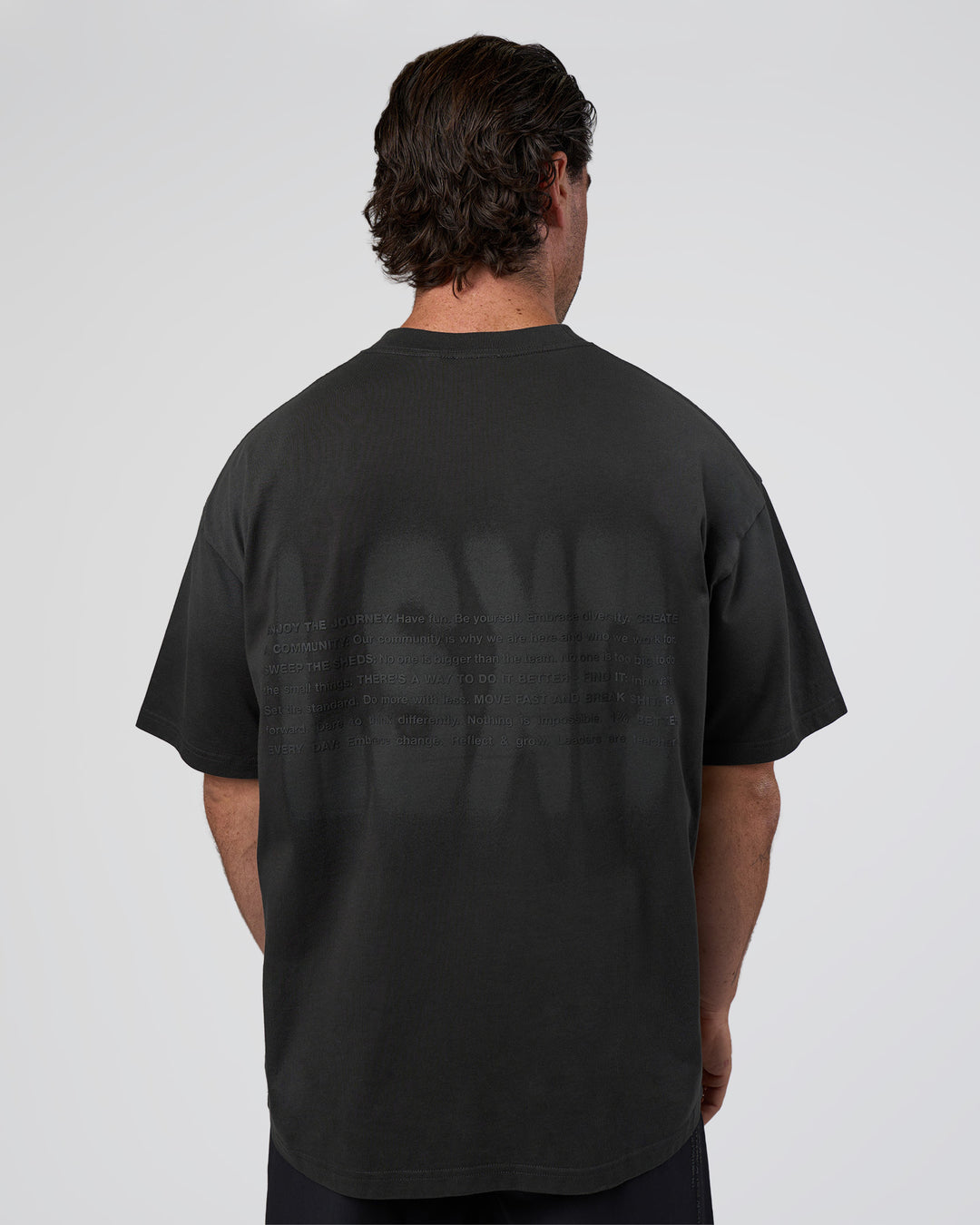 Man wearing Spray Heavyweight Unisex Oversized Tee - Charcoal Washed | Model:Adam | Size:L
