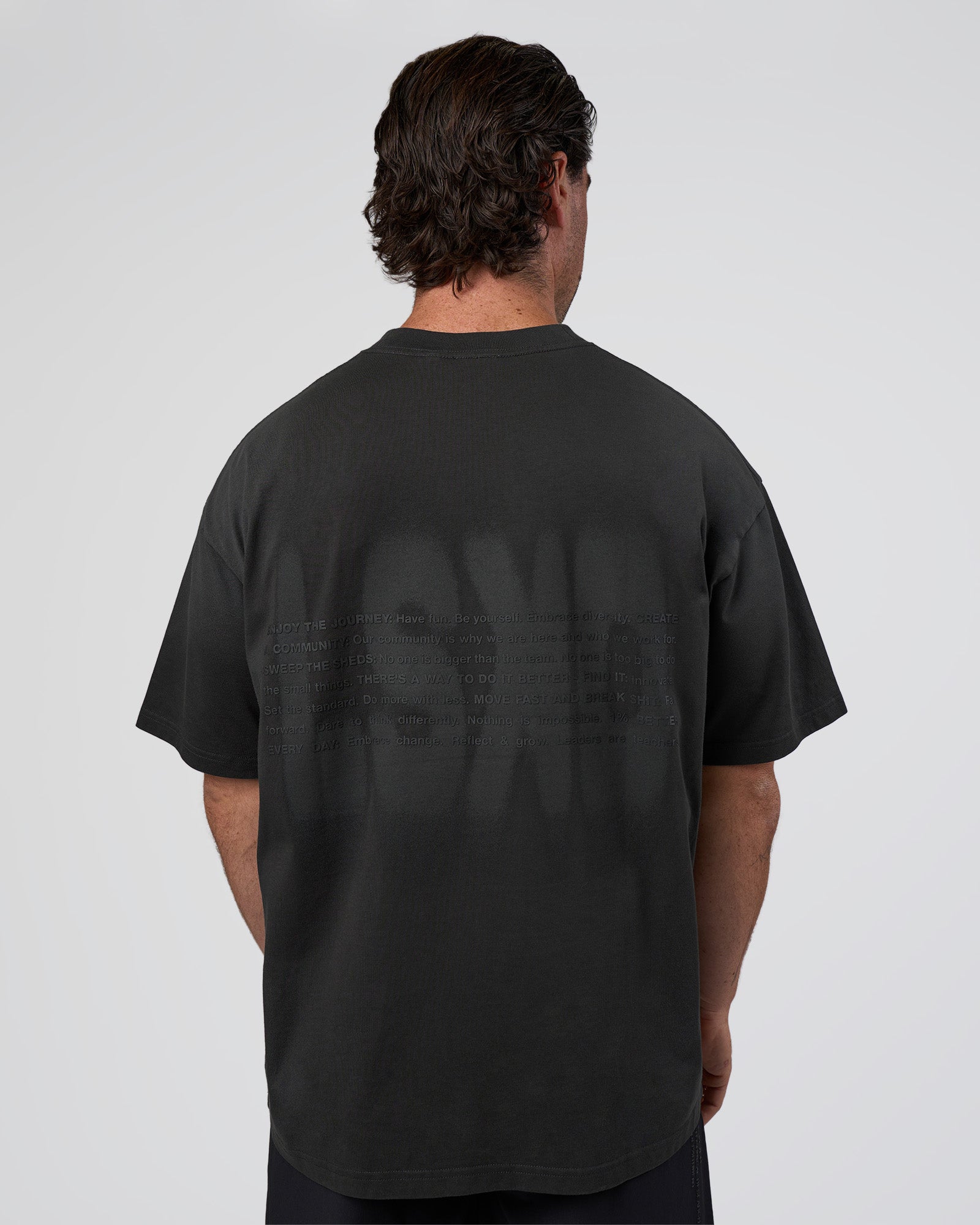 Man wearing Spray Heavyweight Unisex Oversized Tee - Charcoal Washed | Model:Adam | Size:L