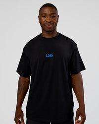 Man wearing Standard Issue FLXCotton Oversized Tee - Black-Palace Blue | Model:Sam | Size:L