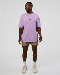 Man wearing Standard Issue FLXCotton Oversized Tee - Pale Lilac-Black | Model:Sam | Size:L