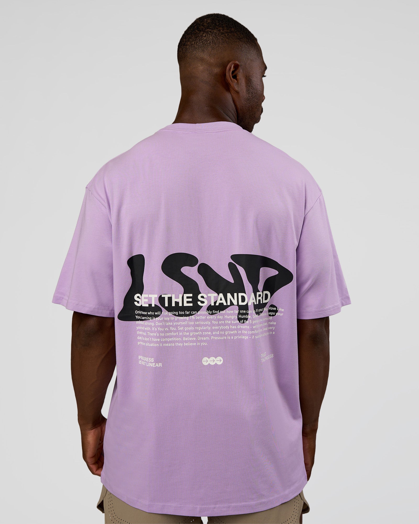 Man wearing Standard Issue FLXCotton Oversized Tee - Pale Lilac-Black | Model:Sam | Size:L