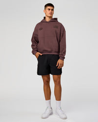 Man wearing Static Grit Unisex Boxy Hoodie - Cocoa Powder-Hot Chocolate | Model:Jackson | Size:L