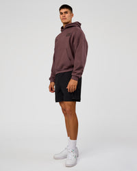 Man wearing Static Grit Unisex Boxy Hoodie - Cocoa Powder-Hot Chocolate | Model:Jackson | Size:L