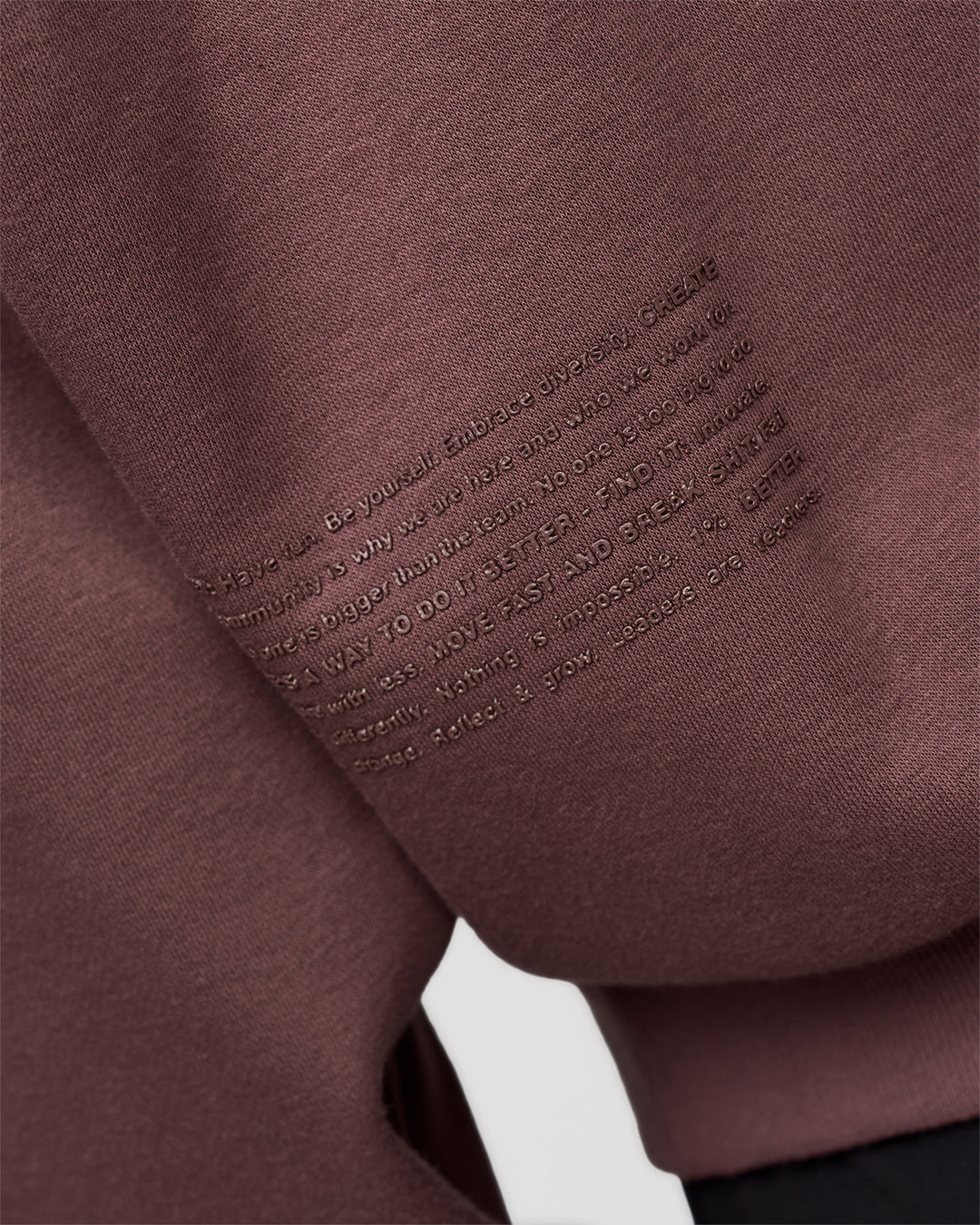 Man wearing Static Grit Unisex Boxy Hoodie - Cocoa Powder-Hot Chocolate | Model:Jackson | Size:L