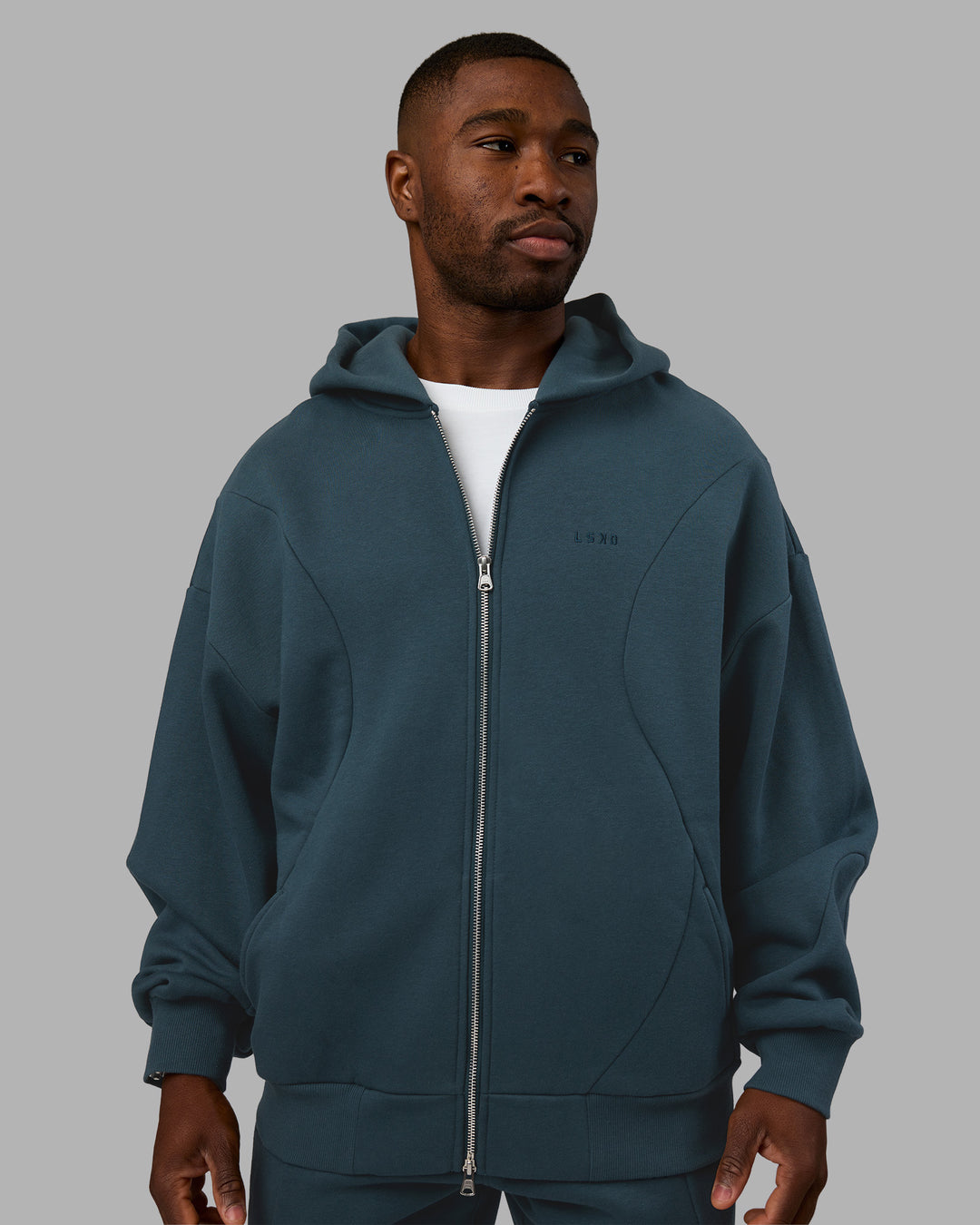 Man wearing Stream Oversized Panel Zip Hoodie - Deep Sea | Model:Sam | Size:L
