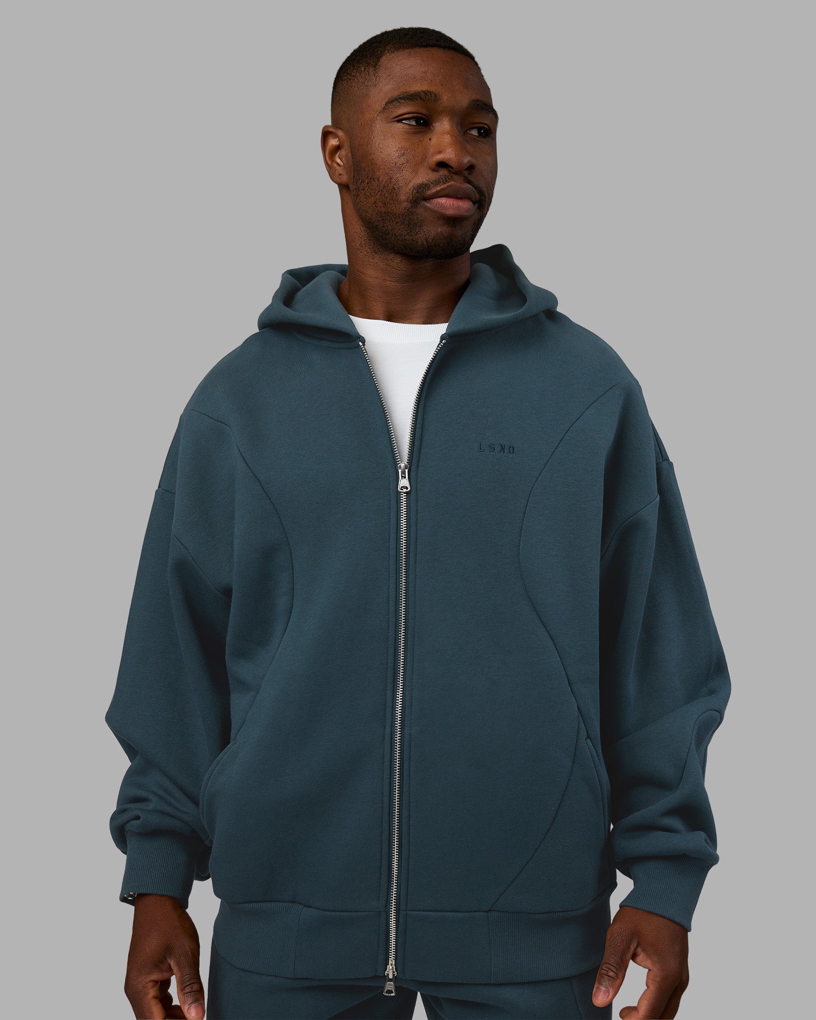 Man wearing Stream Oversized Panel Zip Hoodie - Deep Sea | Model:Sam | Size:L