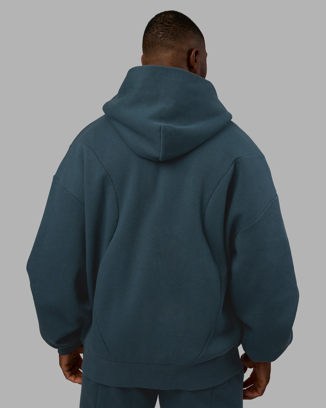 Man wearing Stream Oversized Panel Zip Hoodie - Deep Sea | Model:Sam | Size:L
