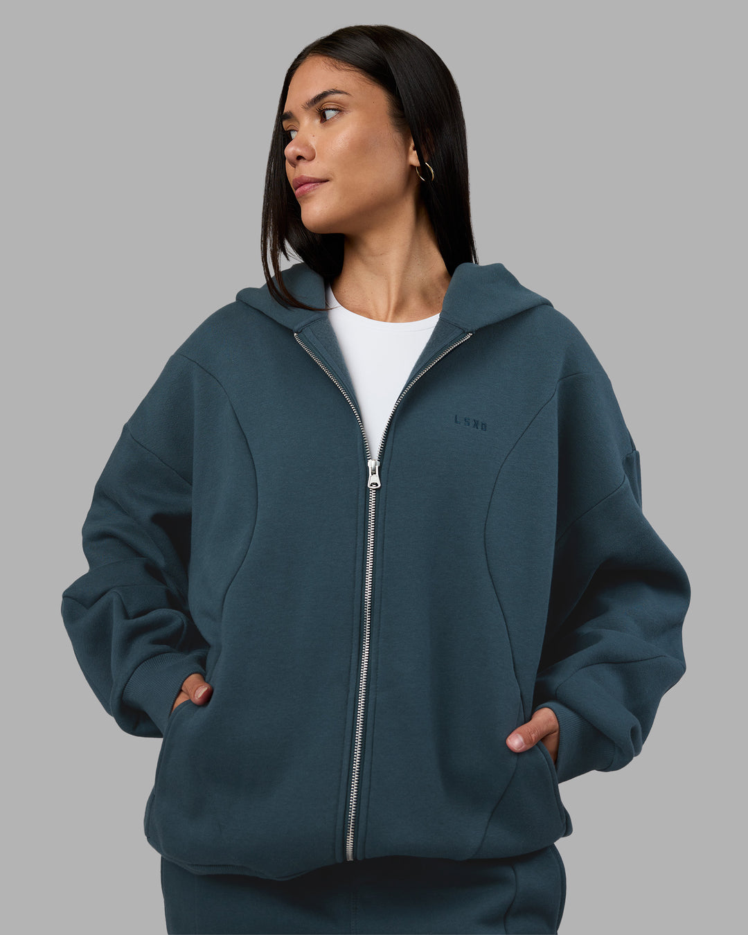 Woman wearing Stream Oversized Panel Zip Hoodie - Deep Sea | Model:Rhiley | Size:L