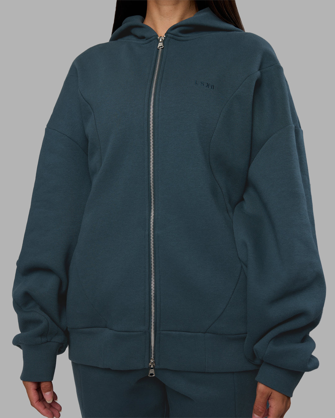 Woman wearing Stream Oversized Panel Zip Hoodie - Deep Sea | Model:Rhiley | Size:L