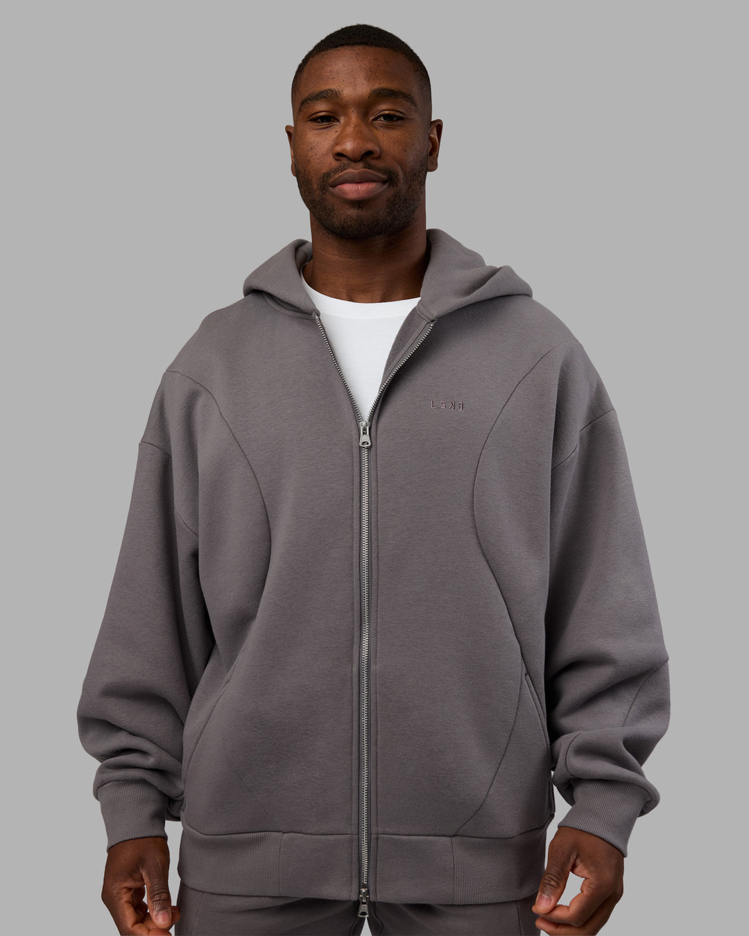 Man wearing Stream Oversized Panel Zip Hoodie - Storm Front | Model:Sam | Size:L