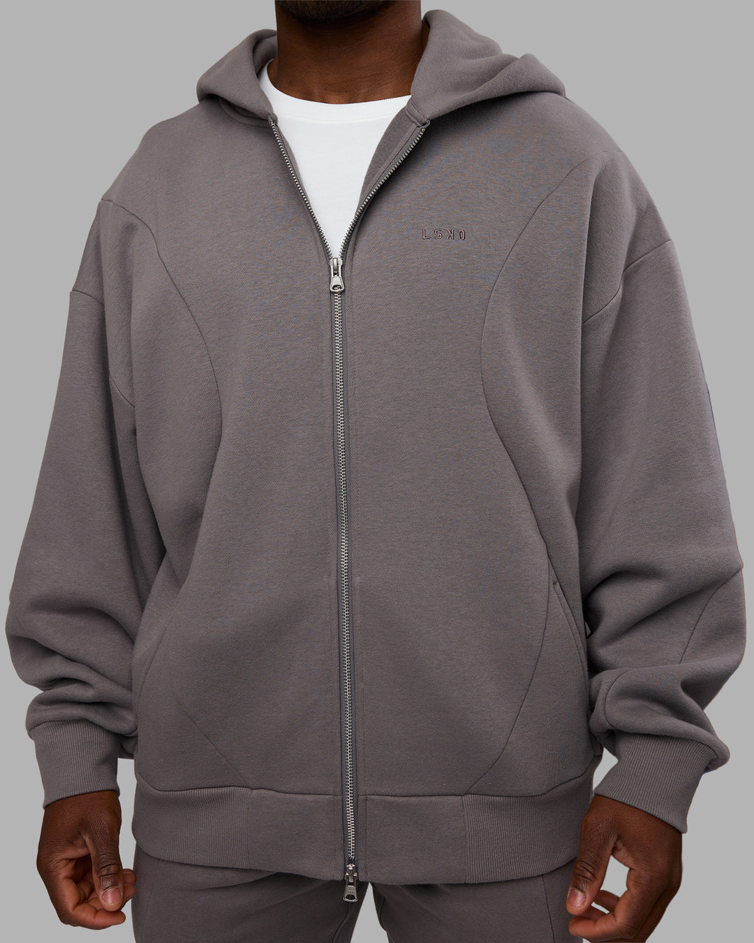 Man wearing Stream Oversized Panel Zip Hoodie - Storm Front | Model:Sam | Size:L