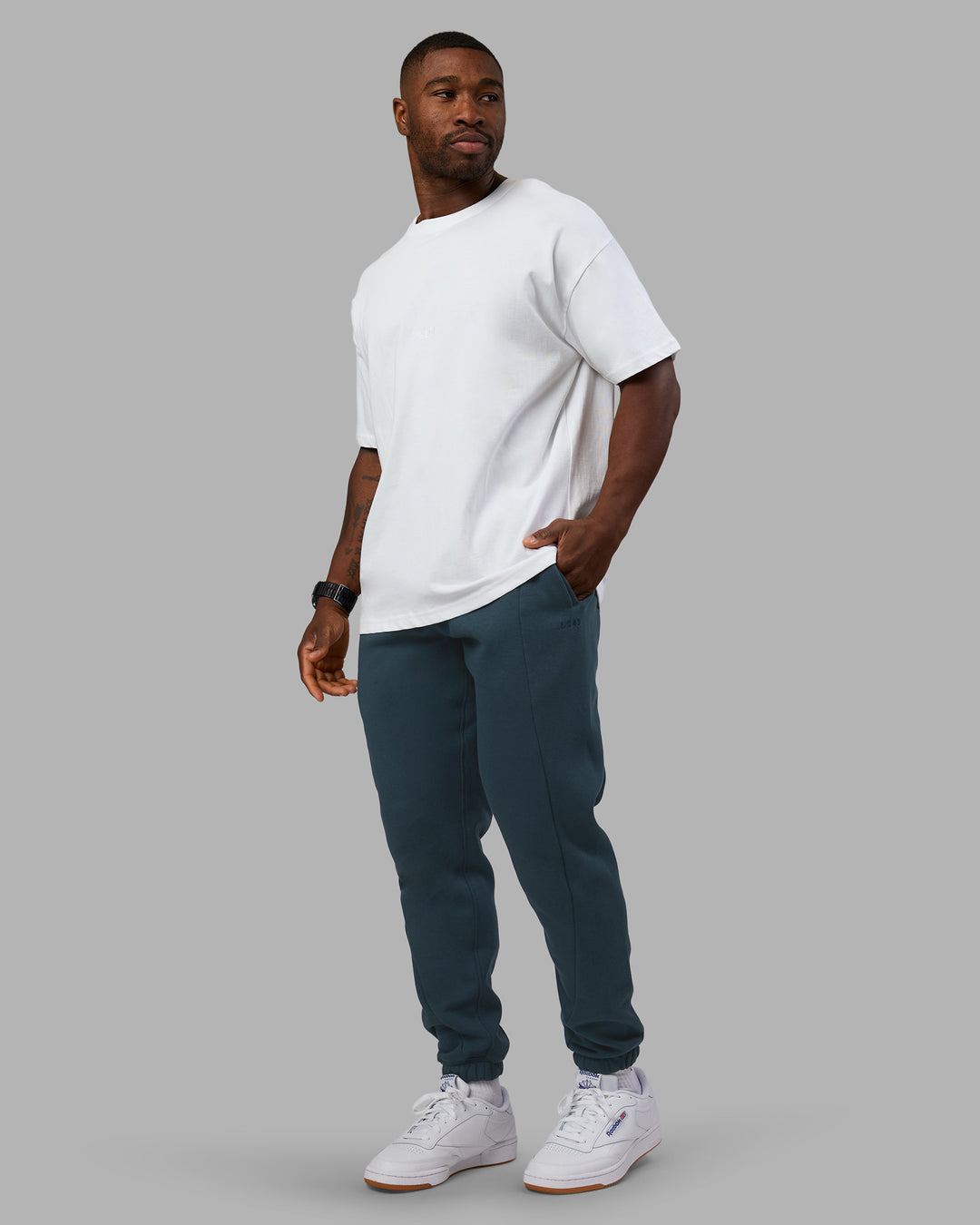 Man wearing Stream Panel Track Pants - Deep Sea | Model:Sam | Size:L