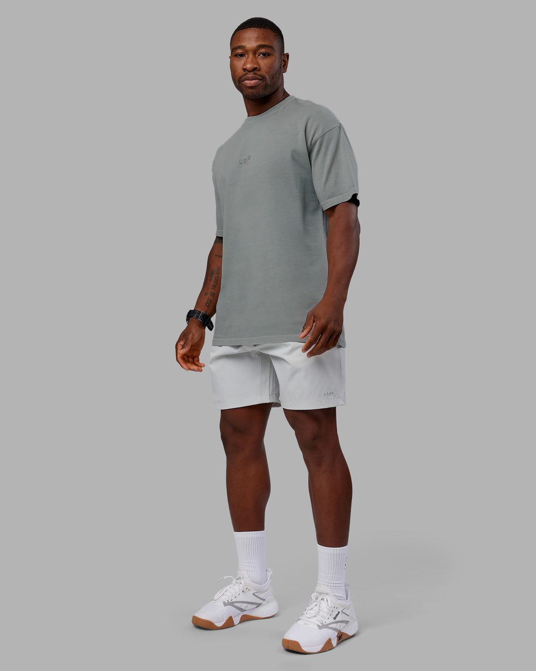 Man wearing Stream Washed Heavyweight Oversized Tee - Washed Circular Grey | Model:Sam | Size:L