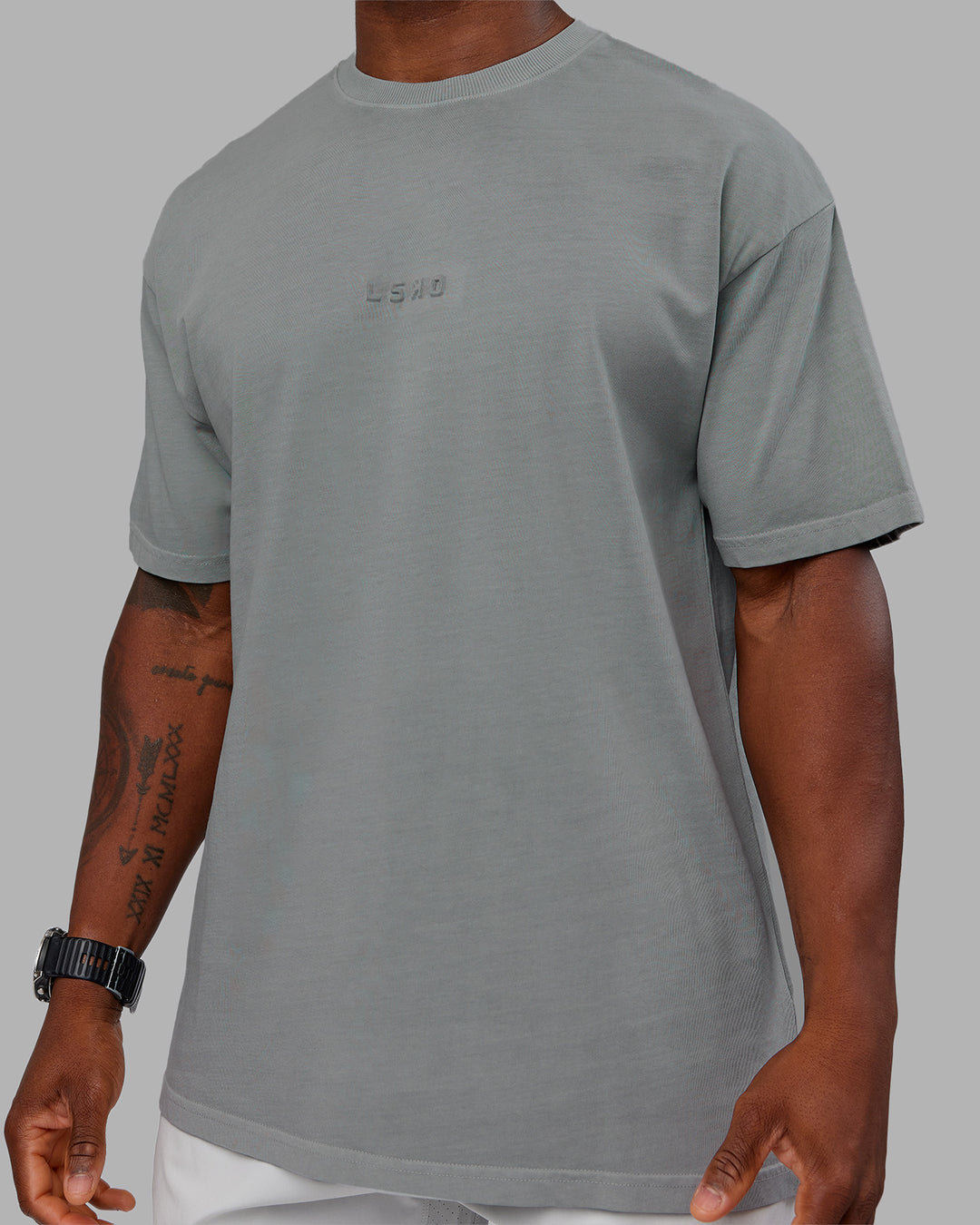 Man wearing Stream Washed Heavyweight Oversized Tee - Washed Circular Grey | Model:Sam | Size:L