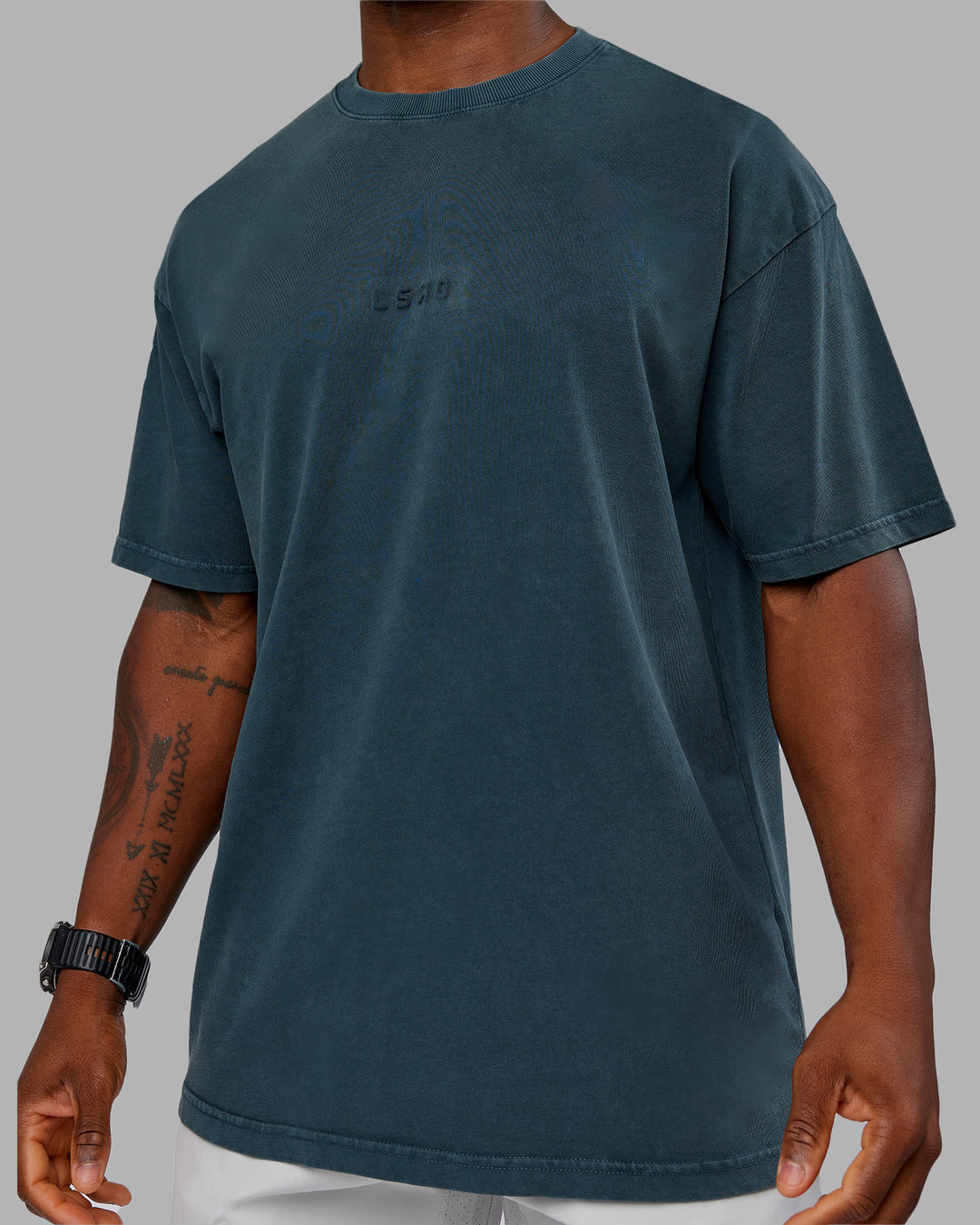 Man wearing Stream Washed Heavyweight Oversized Tee - Washed Deep Sea | Model:Sam | Size:L