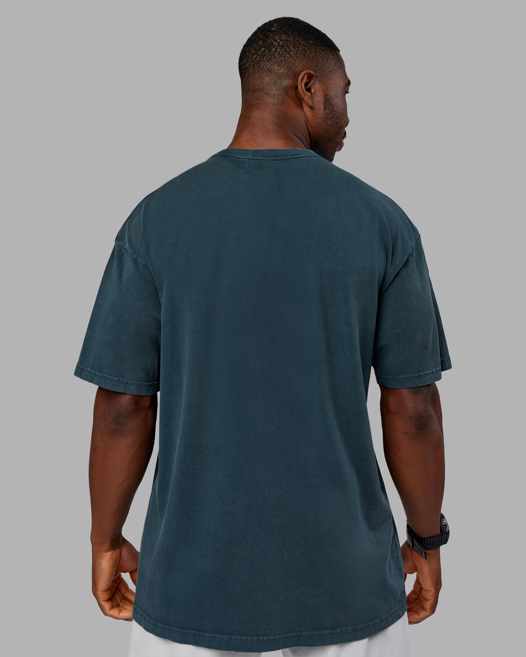 Man wearing Stream Washed Heavyweight Oversized Tee - Washed Deep Sea | Model:Sam | Size:L