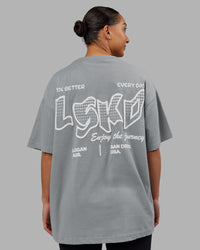 Woman wearing Time's Up Heavyweight Oversized Tee - Circular Grey-White | Model:Ayla | Size:L