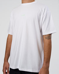 Man wearing Together We Rise FLXCotton Oversized Tee - White-Solar Lime | Model:Zoran | Size:L