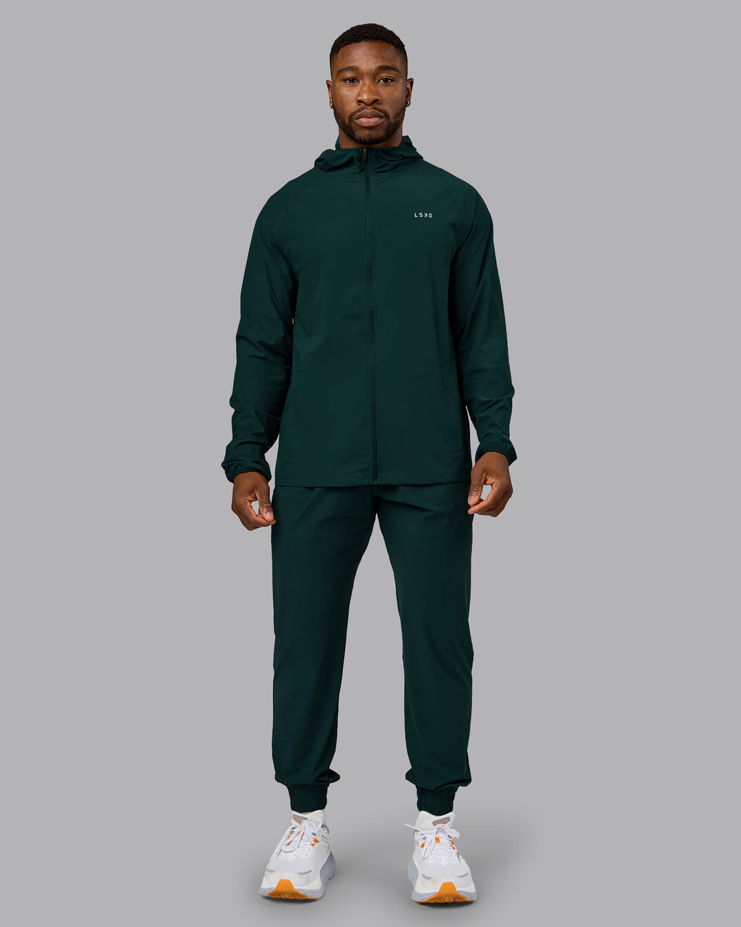Man wearing Train-Lite FLXMAX Jacket - Dark Moss | Model:Sam | Size:L
