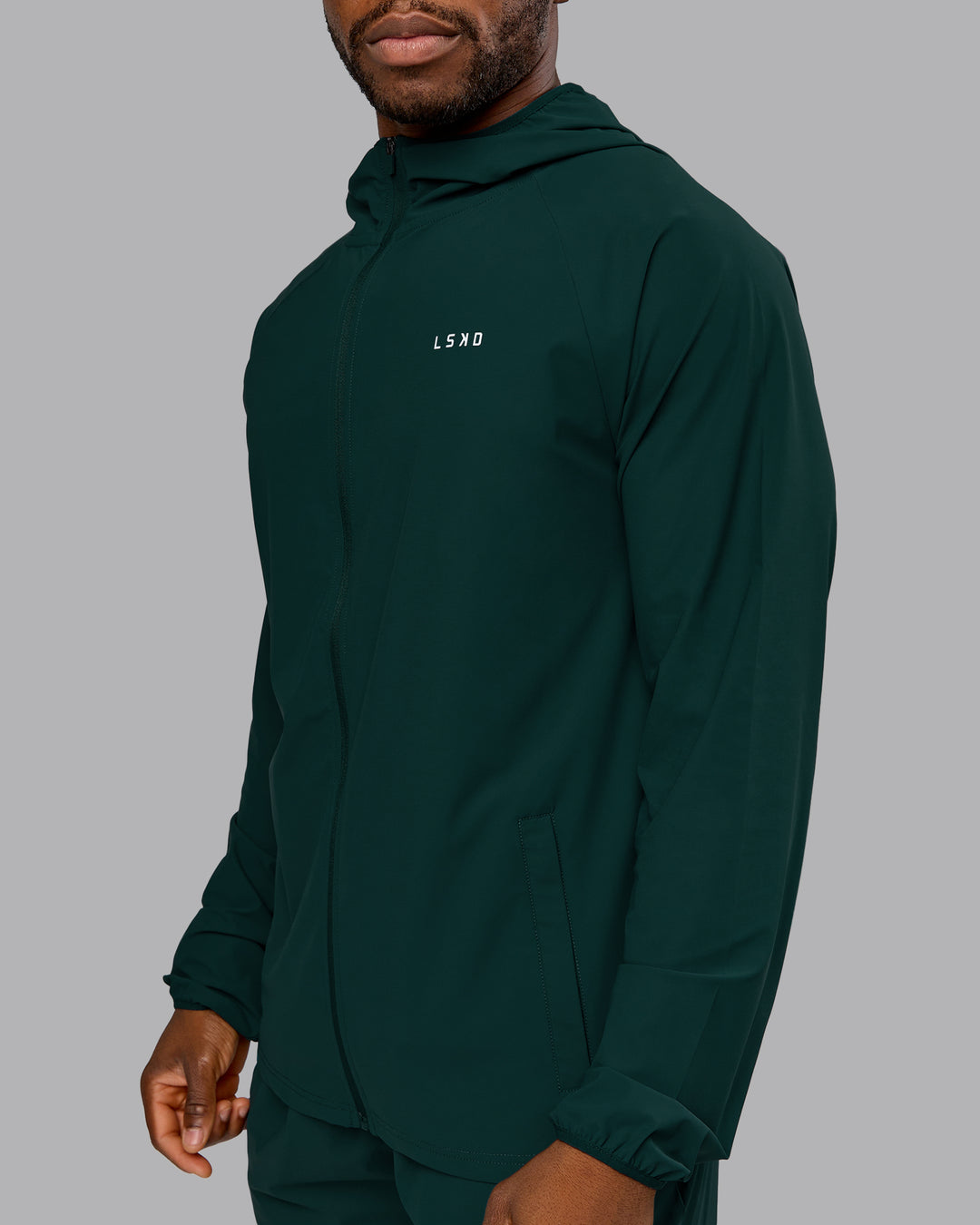 Man wearing Train-Lite FLXMAX Jacket - Dark Moss | Model:Sam | Size:L