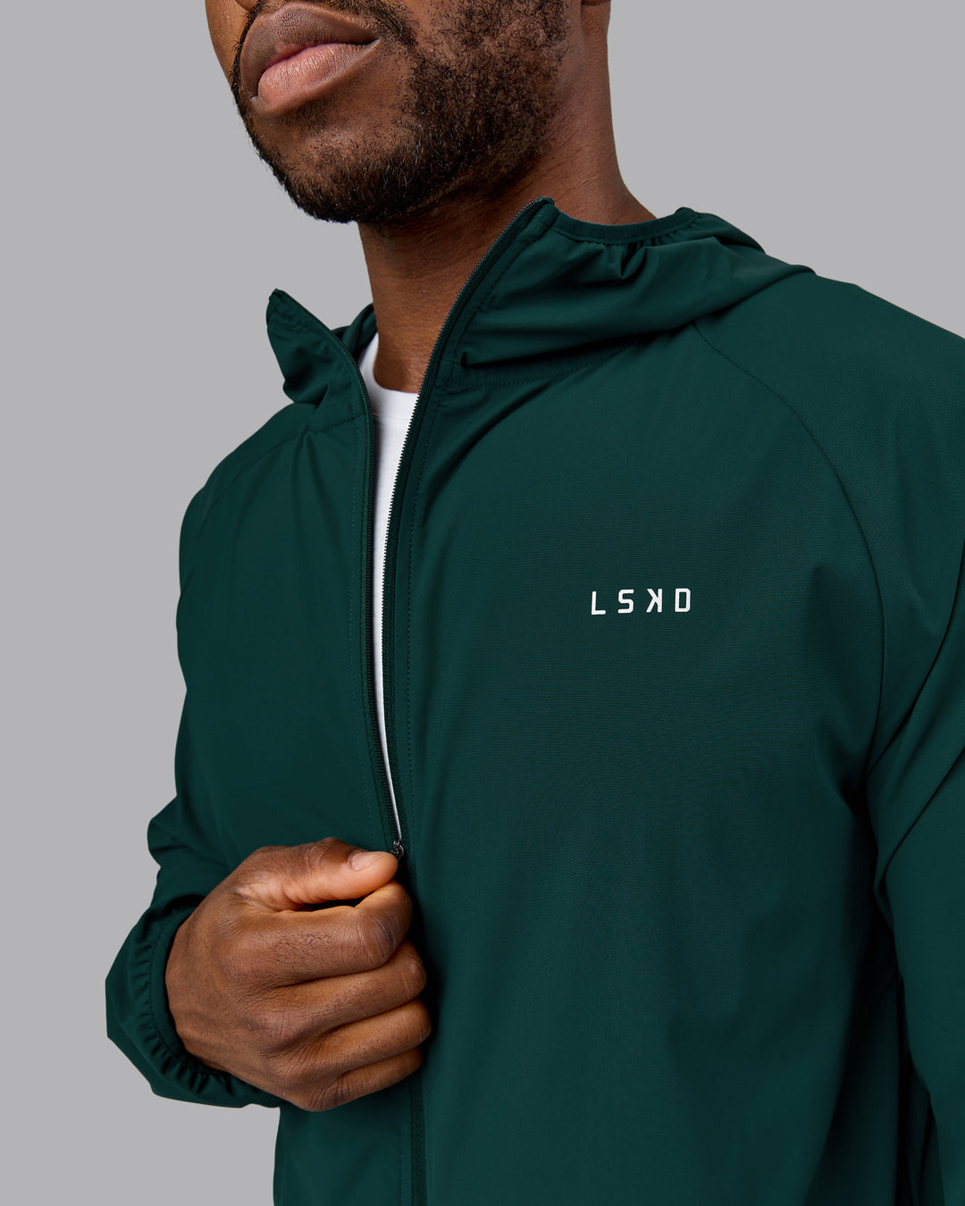 Man wearing Train-Lite FLXMAX Jacket - Dark Moss | Model:Sam | Size:L