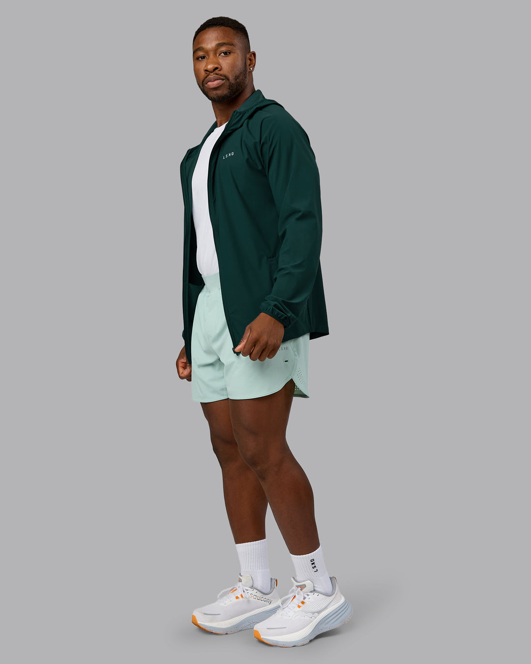 Man wearing Train-Lite FLXMAX Jacket - Dark Moss | Model:Sam | Size:L