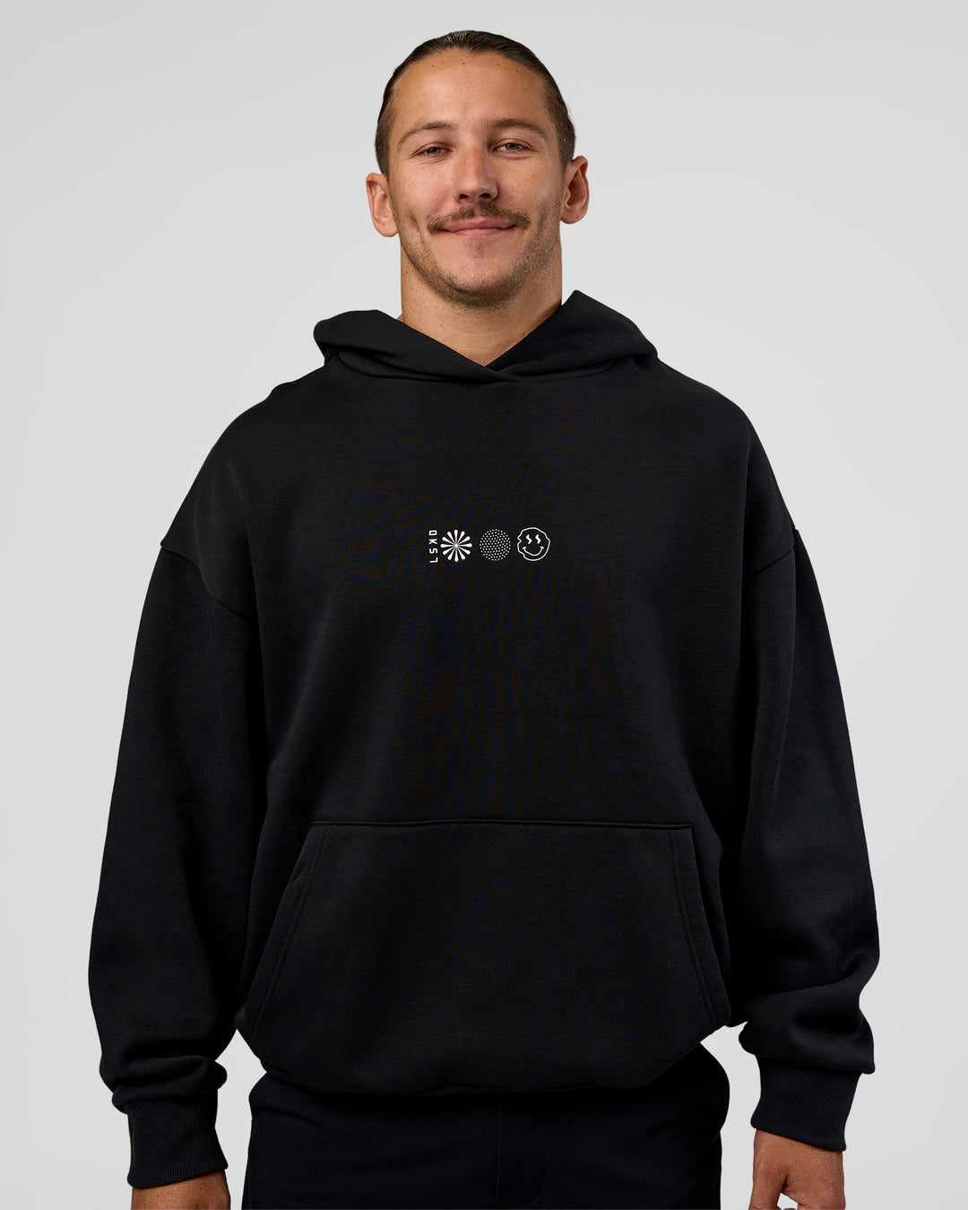 Man wearing Trust The Process Unisex Oversized Hoodie - Black-White | Model:Jaiden | Size:L