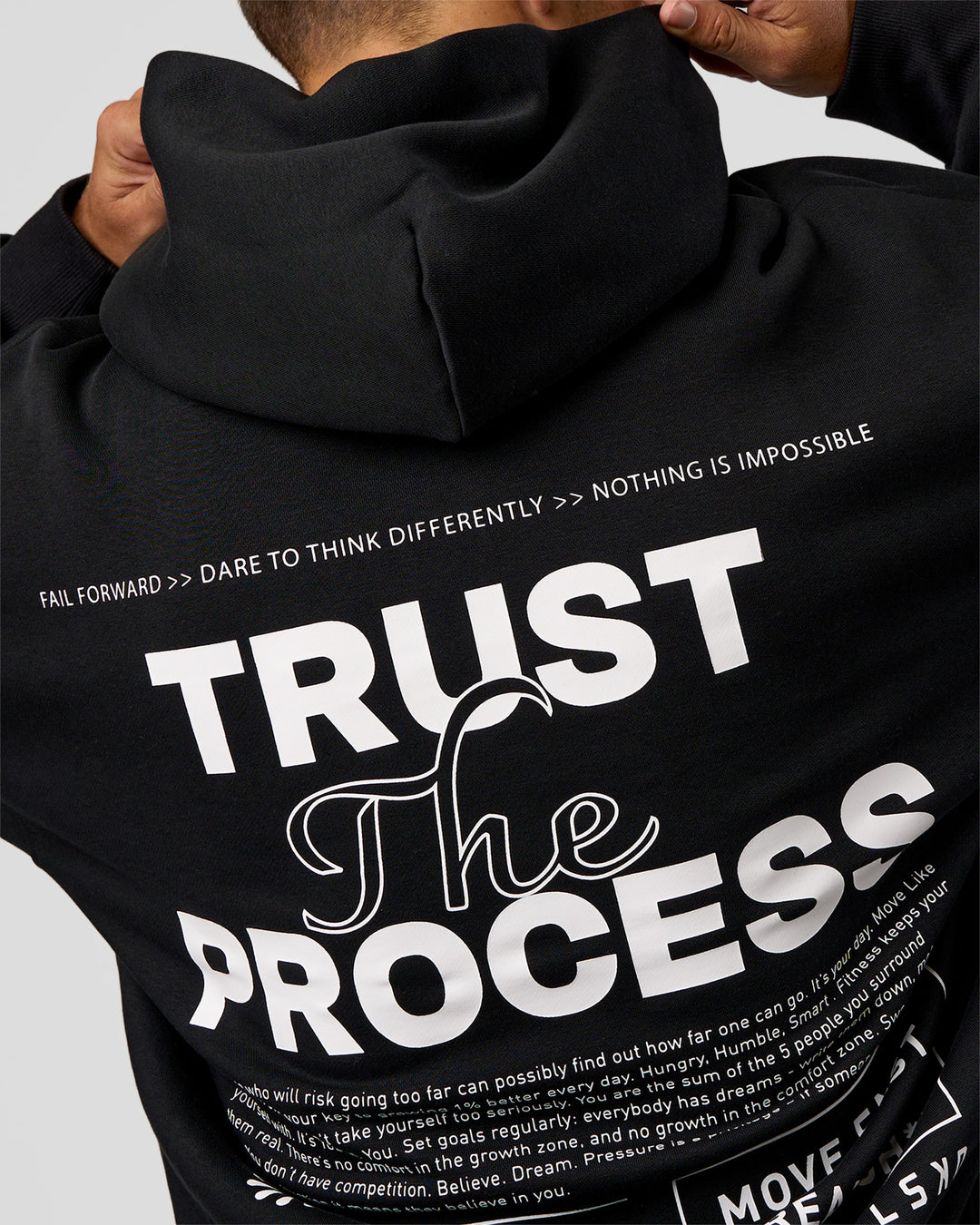 Man wearing Trust The Process Unisex Oversized Hoodie - Black-White | Model:Jaiden | Size:L