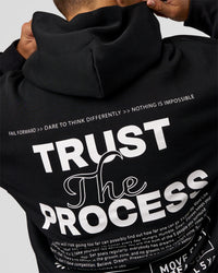 Man wearing Trust The Process Unisex Oversized Hoodie - Black-White | Model:Jaiden | Size:L