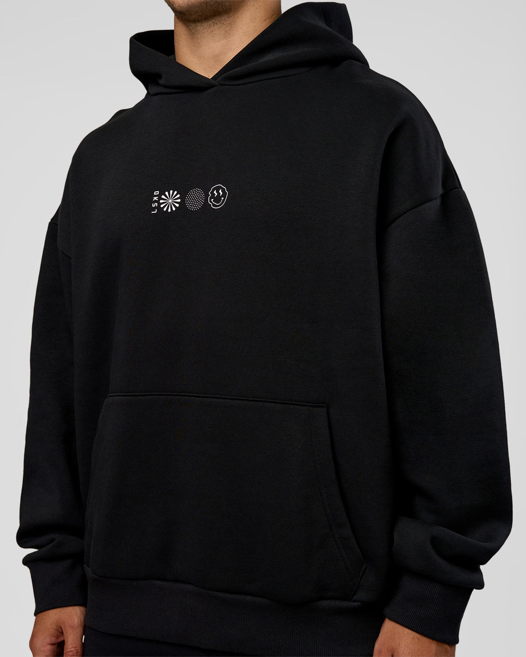 Man wearing Trust The Process Unisex Oversized Hoodie - Black-White | Model:Jaiden | Size:L